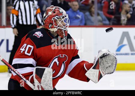 New Jersey Devils goaltender Akira Schmid (40) makes a save against the Tampa  Bay Lightning during the first period of an NHL hockey game Thursday, March  16, 2023, in Newark, N.J. (AP