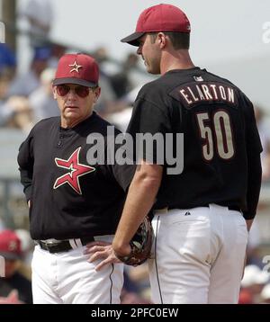 Houston Astros pitching coach Burt Hooten, left, talks to pitcher Scott  Elarton during the third inning against the Pittsburgh Pirates, Friday,  March 9, 2001, in Kissimmee, Fla. Elarton gave up six runs