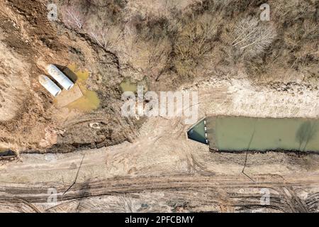 laying or replacement of underground storm sewer pipes. construction site. aerial top view. Stock Photo
