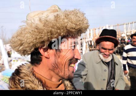 Portrait of an Uyghur man wearing a winter jacket. Picture taken at a weekly market in the outskirts of Kashgar, Xinjiang, China. Stock Photo