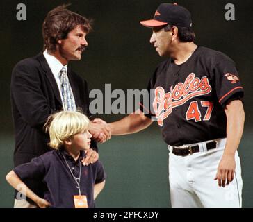 Baltimore Orioles relief pitcher Jesse Orosco shakes hands with former  pitcher Dennis Eckersley as Eckersley's son Jake looks on prior to a game  between the Orioles and the Chicago White Sox at