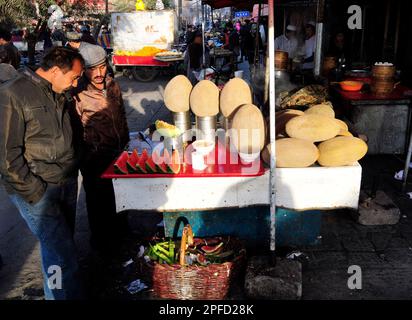 A Melon and Watermelon vendor in the old city in Kashgar, Xinjiang, China. Stock Photo