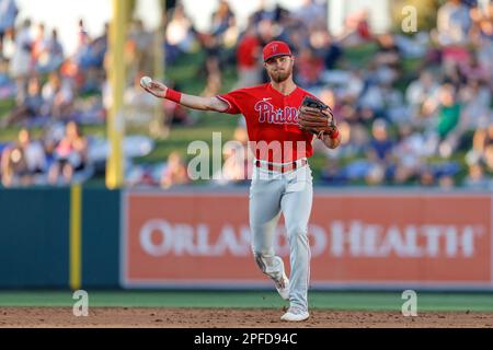 MARCH 16, 2023, Lakeland FL USA; Philadelphia Phillies infielder Jim Haley fields and throws to first bace during an MLB spring training game against Stock Photo