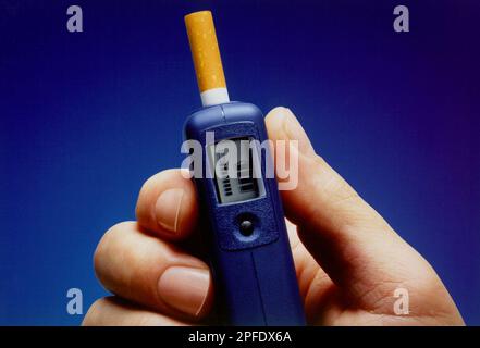 cos cigarette Philip Morris Cos. plans to test a microelectronic cigarette holder, shown  in this undated handout, that eliminates the smoke and ashes from the end  of a cigarette, The New York Times reported