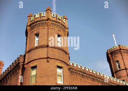 Urban brick buildings lining a city street, showcasing classic architecture, textured brick facades, and modern city atmosphere. Ideal for architectur Stock Photo