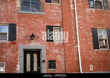 Urban brick buildings lining a city street, showcasing classic architecture, textured brick facades, and modern city atmosphere. Ideal for architectur Stock Photo