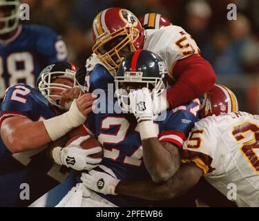 Rodney Hampton (27) of the New York Giants is tackled from behind