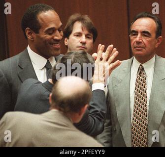 O.J. Simpson (C), seen in a June 27, 1997 file photo after a debtor's ...