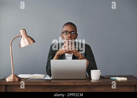 Working from home should be the norm. a young businessman working from home. Stock Photo