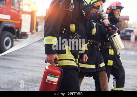 Group of firefighters in protective uniform that is on station Stock Photo