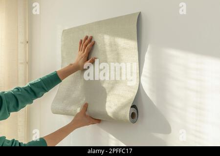 diy interior hand motion closeup repaper wallpaper 2pffc17