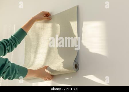 diy interior hand motion closeup repaper wallpaper 2pffc7a