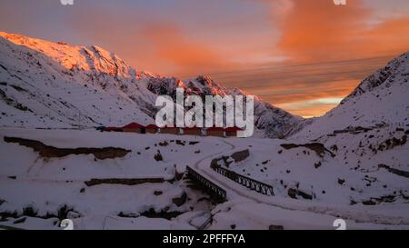 Snow covered mountain, sun rays in Himalayan state Uttarakhand. Dotted with long mountain ranges and glittering jewels in the world map, Uttarakhand i Stock Photo