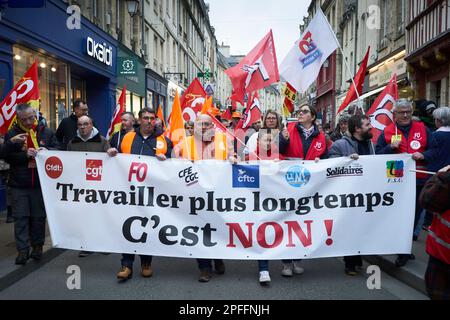 A demonstration in Bayeux, France against the raising of the retirement age to 64. The banner translates as 'To work longer - it's NO!' Stock Photo