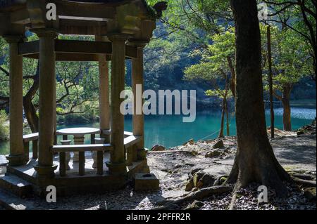 A romantic and dreamy paradise. The pavilion, the turquoise lake and the trees. Spring is the best time for walking trails and lake tours. Xinshan Dre Stock Photo