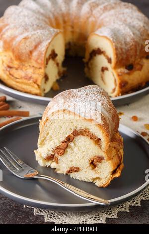 Reindling Austrian or German Easter festive yeasty baking close-up in a plate on the table. Vertical Stock Photo