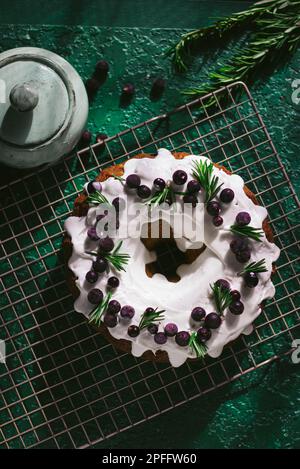 Berry pound cake on a green background. Stock Photo