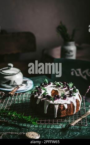 Berry pound cake on a green background. Stock Photo