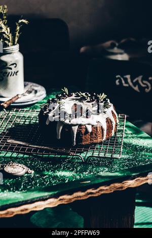 Berry pound cake on a green background. Stock Photo