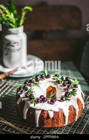 Berry pound cake on a green background. Stock Photo