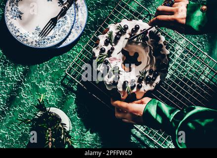 Berry pound cake on a green background. Stock Photo