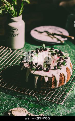 Berry pound cake on a green background. Stock Photo
