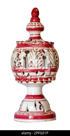 An antique red and white arabian porcelain candle holder isolated on white background Stock Photo