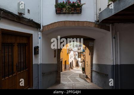 View through an arched passage in the old centre of Guadalupe, Caceres province, Extremadura, Spain. Stock Photo