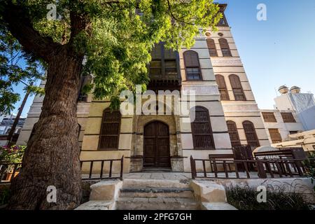 View of the ornate facade of the Nasseef coral town house, Souk al Alawi Street in the historic district of Al-Balad, Jeddah, Saudi Arabia, KSA Stock Photo