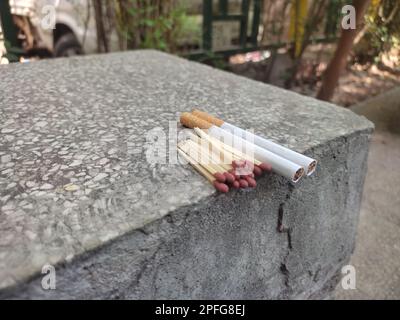Close up of open single cardboard match box on granite stone background, Box filled with tiny match sticks Stock Photo
