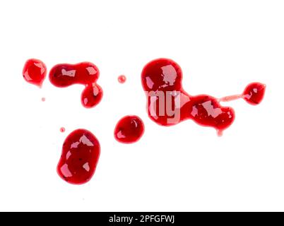 Drops and stains of red berry jam, sauce isolated on white Stock Photo