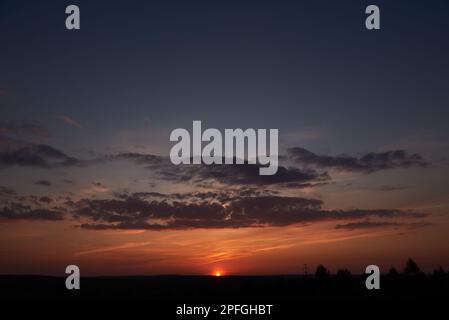 Sky with clouds, with the setting sun. Stock Photo