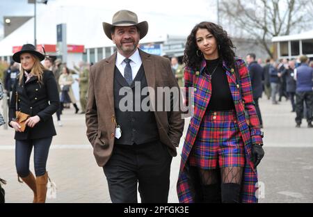 Crowds enter the racecourse including TV presenter from DIY SOS Nick Knowles with girlfriend Katie Dadzie.     Horse racing at Cheltenham Racecourse o Stock Photo