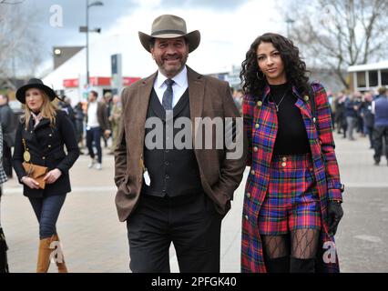 Crowds enter the racecourse including TV presenter from DIY SOS Nick Knowles with girlfriend Katie Dadzie.     Horse racing at Cheltenham Racecourse o Stock Photo