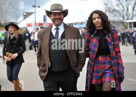 Crowds enter the racecourse including TV presenter from DIY SOS Nick Knowles with girlfriend Katie Dadzie.     Horse racing at Cheltenham Racecourse o Stock Photo