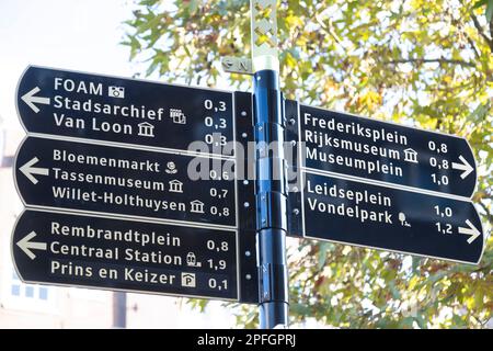 Tourist signage to various destinations in the center of Amsterdam. Stock Photo