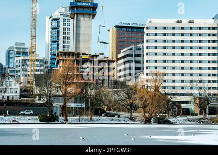 Stavanger, Norway, March 10 2023, City Centre Development Skyline Downtown Stavanger Behind A Frozen Lake Stock Photo