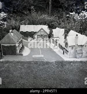 1950s, historical, Blackgang Chime, model village, sign says 'Shanklin Old Village, Isle of Wight, Hampshire, England, UK. Opened in 1843, Blackgang Chine is an old amusement park on the coast of the island. Stock Photo