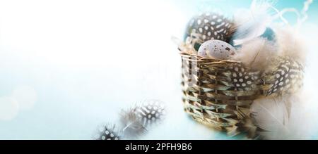 Happy Easter! Festive banner design with decoration Easter eggs in vintage basket. Copy space Stock Photo