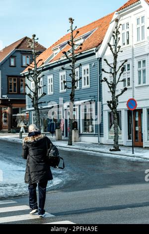 Stavanger, Norway, March 10 2023, One Woman Crossing Road Old Town Stavanger Stock Photo