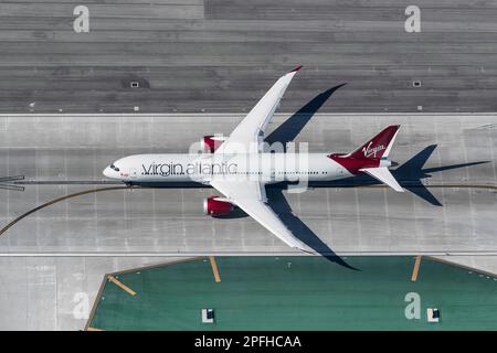 Commercial airliner taking off at LAX Los Angeles International Airport seen from a helicopter Stock Photo