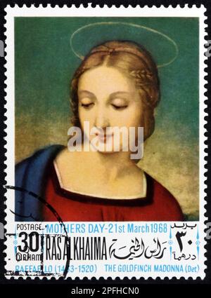 RAS AL-KHAIMAH - CIRCA 1968: a stamp printed in Ras al-Khaimah shows Madonna with the goldfinch, painting by Raphael (1483-1520) Italian painter, circ Stock Photo