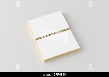 Business card with gold trim mockup. Two stacks of business cards on white background. Side view Stock Photo