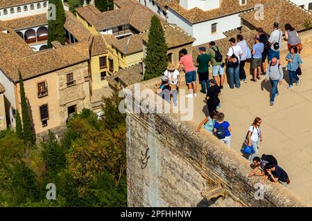 Tourists visiting the Alhambra Palace in Granada Andalucia Spain a UNESCO World Heritage Site and major tourist attraction Stock Photo