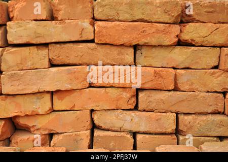 In the pile is a ready-made fired brick made of clay Stock Photo