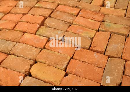 In the pile is a ready-made fired brick made of clay Stock Photo