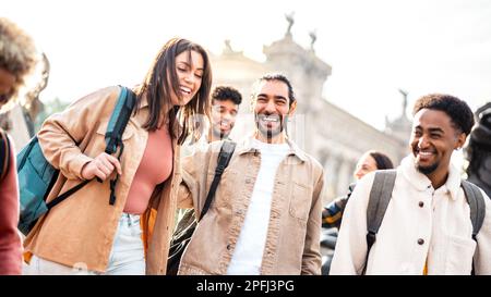 Multi racial happy friends having genuine fun around Barcelona center - Friendship life style concept on young genz people meeting out side together Stock Photo