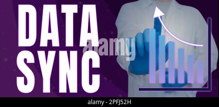 Writing displaying text Data Sync. Word Written on data that is continuously generated by different sources Stock Photo