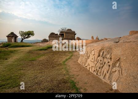 Ruins on Hemakuta Hill in Hampi and carvings of Ram Laxman and Sita on rocks. Hampi, the capital of the Vijayanagar empire is a UNESCO World Heritage Stock Photo
