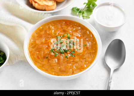 Cabbage (sauerkraut) soup or kislye shchi in bowl. Close up view Stock Photo